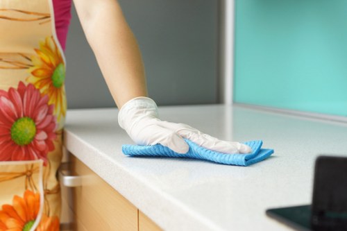 Cleaning technician handling waste water and disposal materials